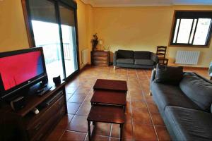 Telewizja i/lub zestaw kina domowego w obiekcie Casa de O Rosal