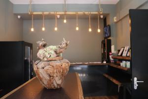 a vase sitting on top of a table in a store at Amsterdam Hostel Annemarie in Amsterdam