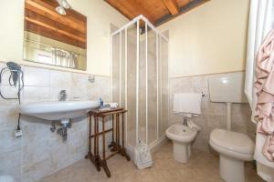 a bathroom with a sink and a toilet at Ca' Noemi in Venice-Lido +33 photos