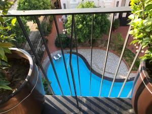 a view of a pool from a balcony at F & F Hotel in Hai Phong