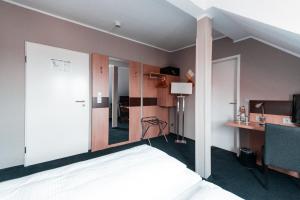 Voodi või voodid majutusasutuse Hotel am Rothenbaum toas
