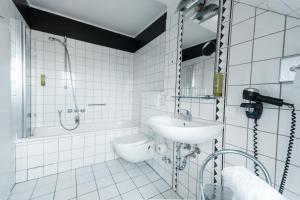 Vannituba majutusasutuses Hotel am Rothenbaum