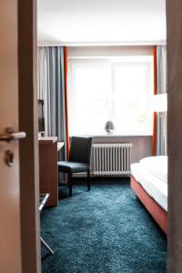 Voodi või voodid majutusasutuse Hotel am Rothenbaum toas