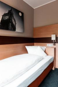 Voodi või voodid majutusasutuse Hotel am Rothenbaum toas
