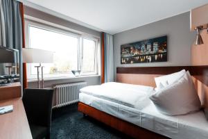 Voodi või voodid majutusasutuse Hotel am Rothenbaum toas