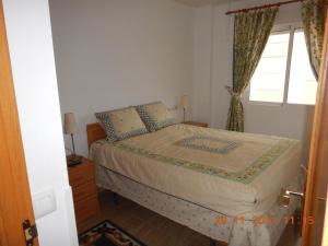 En eller flere senge i et værelse på Amarillo Apartment + 18 billeder