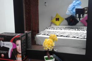 Postel nebo postele na pokoji v ubytování Ella Fresh Point Homestay