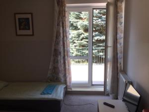 Posteľ alebo postele v izbe v ubytovaní Wilanowska Hostel
