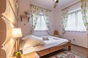 Posteľ alebo postele v izbe v ubytovaní Apartamenty Stylowe Zakopane