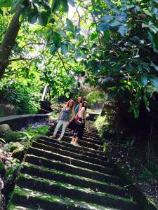 a group of people standing on some stairs at Juo House in Fanlu