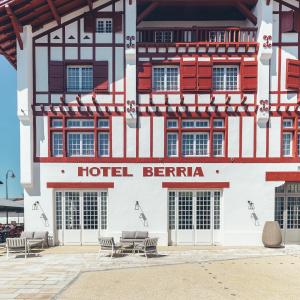 a hotel berarte with chairs in front of it at Hotel Berria in Hasparren