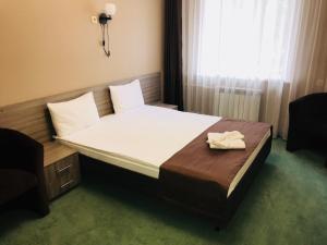 
Кровать или кровати в номере Отель ГагарInn
