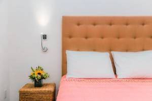 Postel nebo postele na pokoji v ubytování Los Milagros Hotel