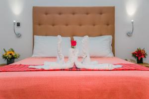 Postel nebo postele na pokoji v ubytování Los Milagros Hotel