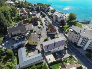 an aerial view of a small town by the water at Villa Desiree - Hotel Garni - Adults Only in Egg am Faaker See