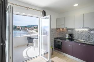 Kuchyň nebo kuchyňský kout v ubytování Apartments Franičević