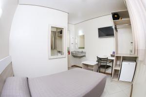 TV a/nebo společenská místnost v ubytování Hotel Express Savoy - Centro Histórico