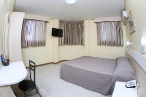 TV a/nebo společenská místnost v ubytování Hotel Express Savoy - Centro Histórico