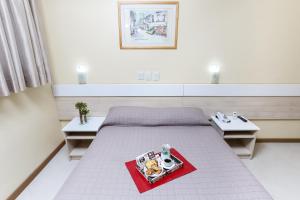 Postel nebo postele na pokoji v ubytování Hotel Express Savoy - Centro Histórico