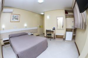 Postel nebo postele na pokoji v ubytování Hotel Express Savoy - Centro Histórico