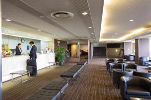 a waiting area of a hospital with people standing at a counter at Hotel Anesis Seto-Ohashi in Utazu