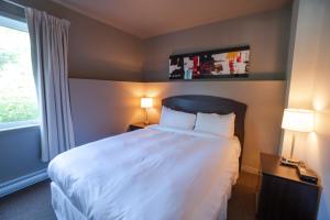 Postel nebo postele na pokoji v ubytování Condos Château-Bromont