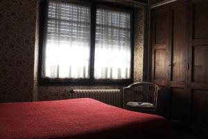 Hostal Rita Belvedere tesisinde bir odada yatak veya yataklar