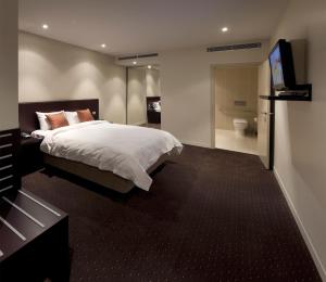 Postel nebo postele na pokoji v ubytování Atlantis Hotel Melbourne