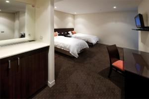 Postel nebo postele na pokoji v ubytování Atlantis Hotel Melbourne
