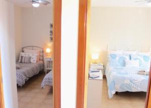 A bed or beds in a room at Villa Amistad
