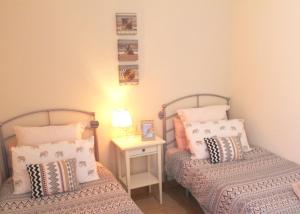 A bed or beds in a room at Villa Amistad