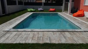 a small swimming pool in the backyard of a house at Family Villa Pool & Beach in Caparica