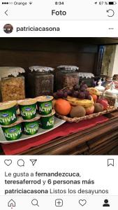 a counter with jars of food and fruit on it at La Casona de Benito in Cudillero