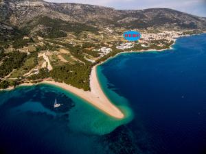 an aerial view of a beach and the ocean at Villa Blanka Bol save 15 percent on Split-villas com in Bol