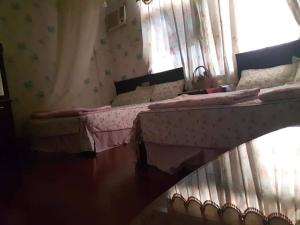 Postel nebo postele na pokoji v ubytování Dai Yi Shia B&B