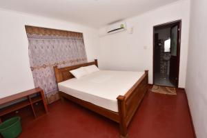 Letto o letti in una camera di Pidurangala View Home Stay