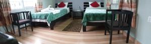 Llit o llits en una habitació de Harvest Moon Guest House