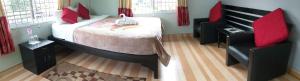 Llit o llits en una habitació de Harvest Moon Guest House