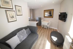 a living room with a couch and a table at Number 18 Apartments in Exeter