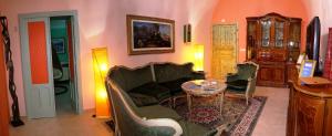 a living room with a couch and a table at Mamma Puglia Suite & Breakfast in Santeramo in Colle