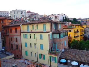 a group of buildings with colorful windows and roofs at trompe l'oeil in Perugia