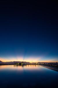 a view of a body of water at sunset at Nalagi Hotel in Nadi