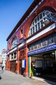 a red brick building with a sign on the front of it at The Hurdwick in London