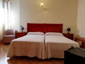 A bed or beds in a room at Labella María