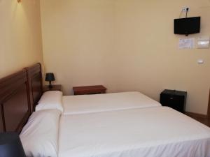 A bed or beds in a room at Labella María