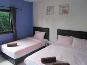 Postel nebo postele na pokoji v ubytování Pineapple Guesthouse