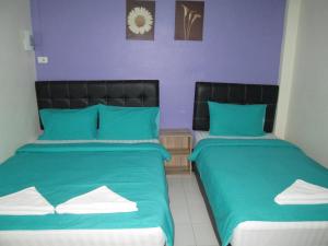 Postel nebo postele na pokoji v ubytování Pineapple Guesthouse