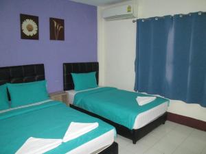 Postel nebo postele na pokoji v ubytování Pineapple Guesthouse