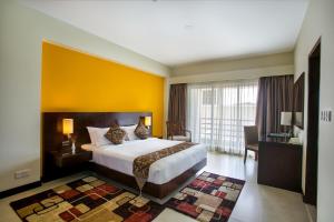 Säng eller sängar i ett rum på Hotel Grand Park Barishal