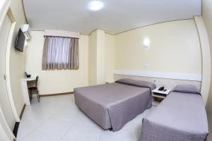 Postel nebo postele na pokoji v ubytování Hotel Express Savoy - Centro Histórico